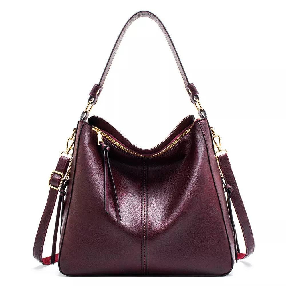 Women's hobo bag in PU material with multiple compartments and a zipper opening