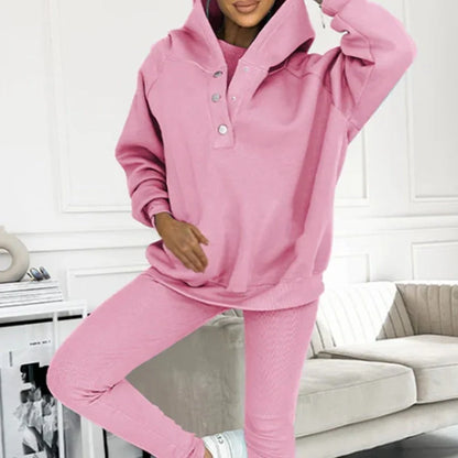Women's 3-piece sports suit featuring a hooded sweatshirt with pockets and slim trousers