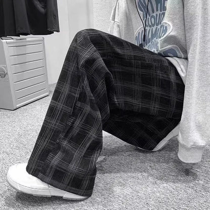 Men's black and green plaid straight leg trousers showing mid-waist design and six size options