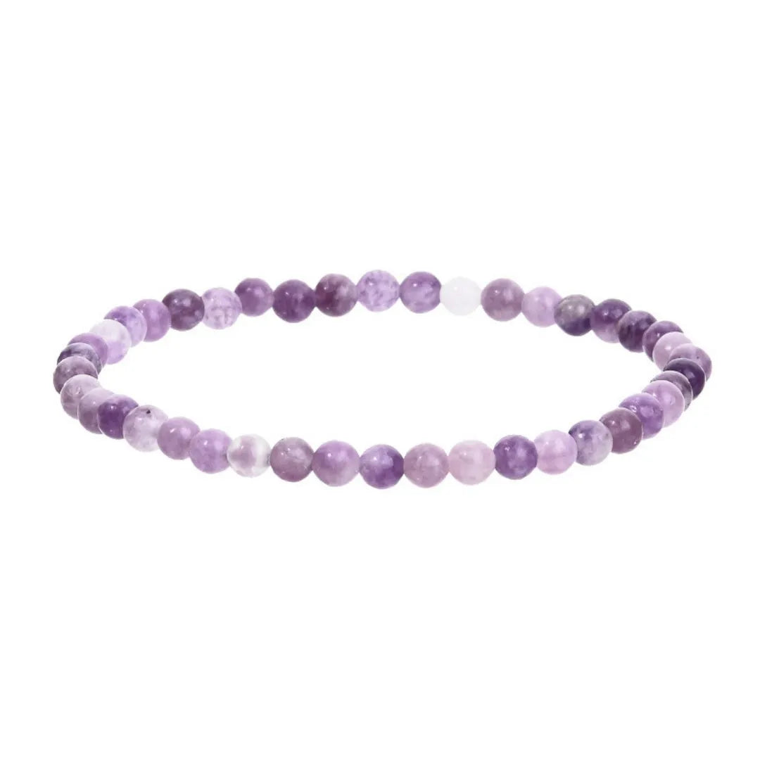 Purple geometric stone bead bracelet on an elastic band, showing manual craftsmanship.