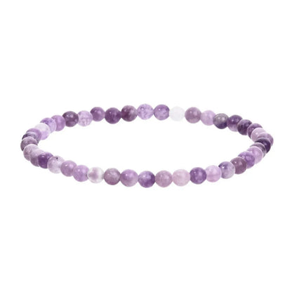 Purple geometric stone bead bracelet on an elastic band, showing manual craftsmanship.