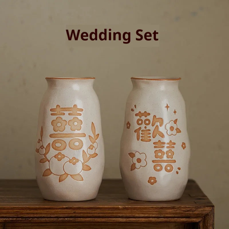 Hand-painted Chinese ceramic vase with carved detail on a desk, shown in Double Happiness colour design.