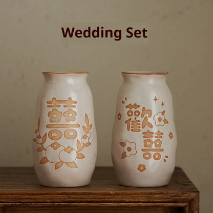 Hand-painted Chinese ceramic vase with carved detail on a desk, shown in Double Happiness colour design.
