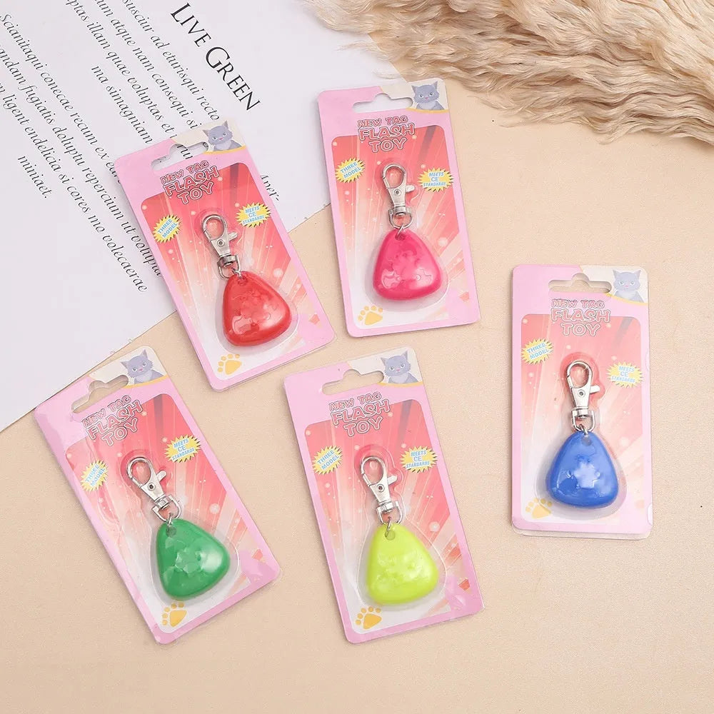 Silicone triangle-shaped light-up pendant pet ornament in one of five colours: red, pink, blue, green, or yellow.