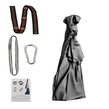 Child in black therapy swing cocoon with multi-loop daisy chain height adjustment system