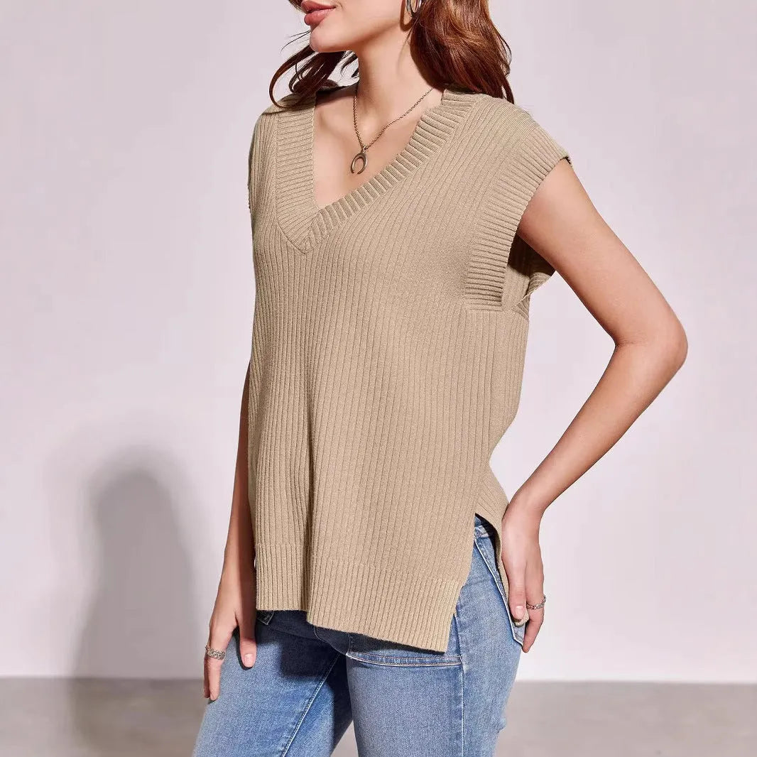 Camel coloured loose v-neck sleeveless vest with a striped pattern on a hanger.