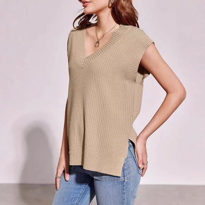 Camel coloured loose v-neck sleeveless vest with a striped pattern on a hanger.