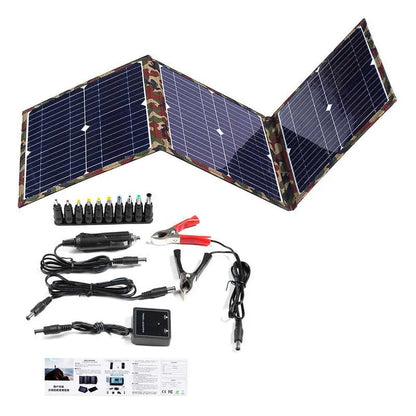 Black foldable portable solar panel unfolded showing solar cells, with included car charger and USB adapter.