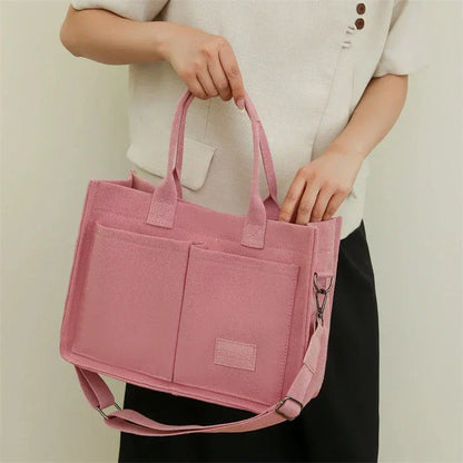Premium canvas tote bag in multiple colors with adjustable shoulder strap and organizational pockets