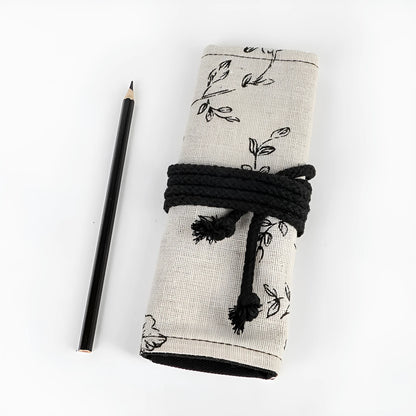 Black peony floral print canvas pencil roll bag open to show 24 or 72 pencil slots.