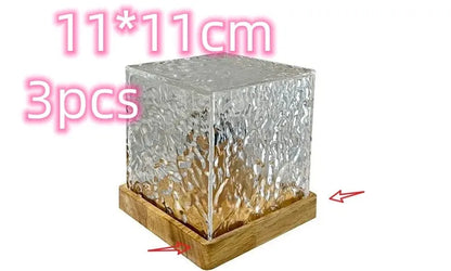 LED water ripple projection night light with remote control on wooden base showing colourful light patterns