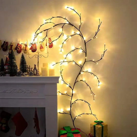 Flexible willow vine LED light garland with birch bark texture, bent into shape with warm white LEDs