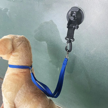 Pet bathing restraint device with suction cup handcuffs and traction rope in black or blue colour