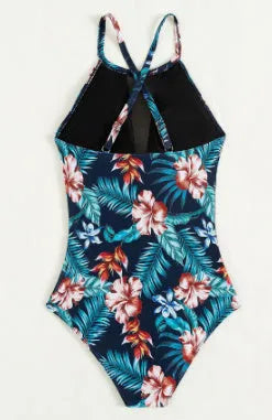 Women's deep V-neck one-piece swimsuit with a printed pattern in a solid colour.