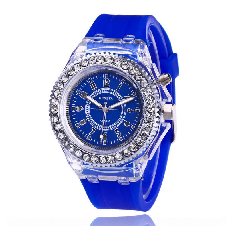 Women's LED luminous quartz watch with silicone strap and round alloy case on wrist