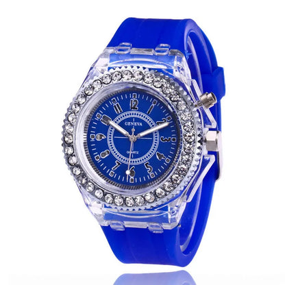 Women's LED luminous quartz watch with silicone strap and round alloy case on wrist