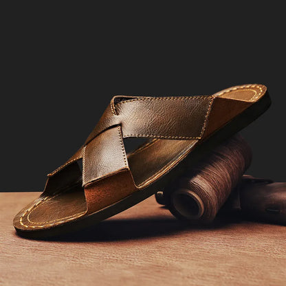 Men's black genuine leather slip-on sandals with rubber sole on a neutral background.
