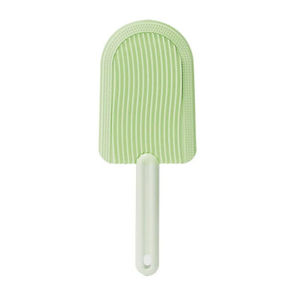 Green ice cream shaped pet grooming brush with soft silicone teeth for cats and dogs