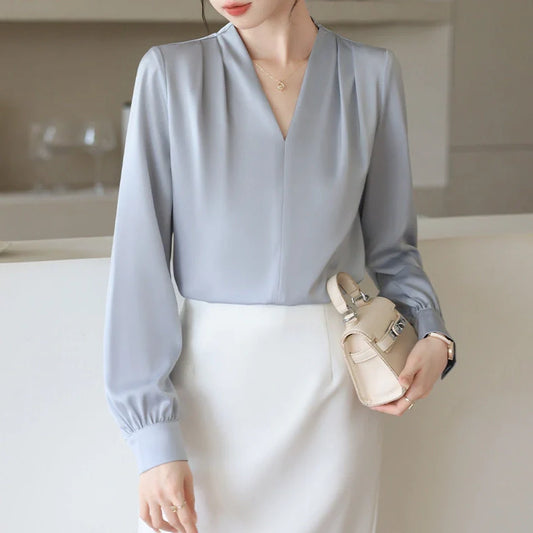 Women's blue long sleeve shirt with slim fit design and 3D stitching construction detail