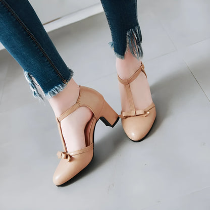 Women's chunky heel sandals with bow detail and adjustable buckle strap in solid colour