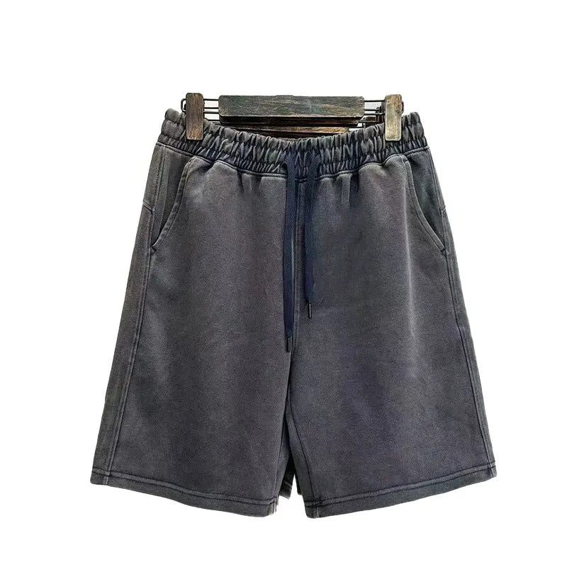 Men's distressed cotton shorts in straight loose casual style with fifth pants length, available in navy blue, mud lime, charcoal black, and grass green colours, sized from S to 2XL with Asian sizing noted