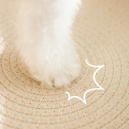 Green oval-shaped sisal cat scratching pad with a central bowl, serving as a cat bed and furniture protector.