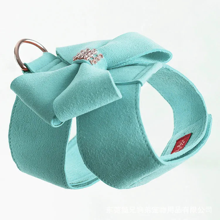 Puppy wearing a pink microfiber chest strap with a bowknot, adjustable in sizes S, M, L, XL