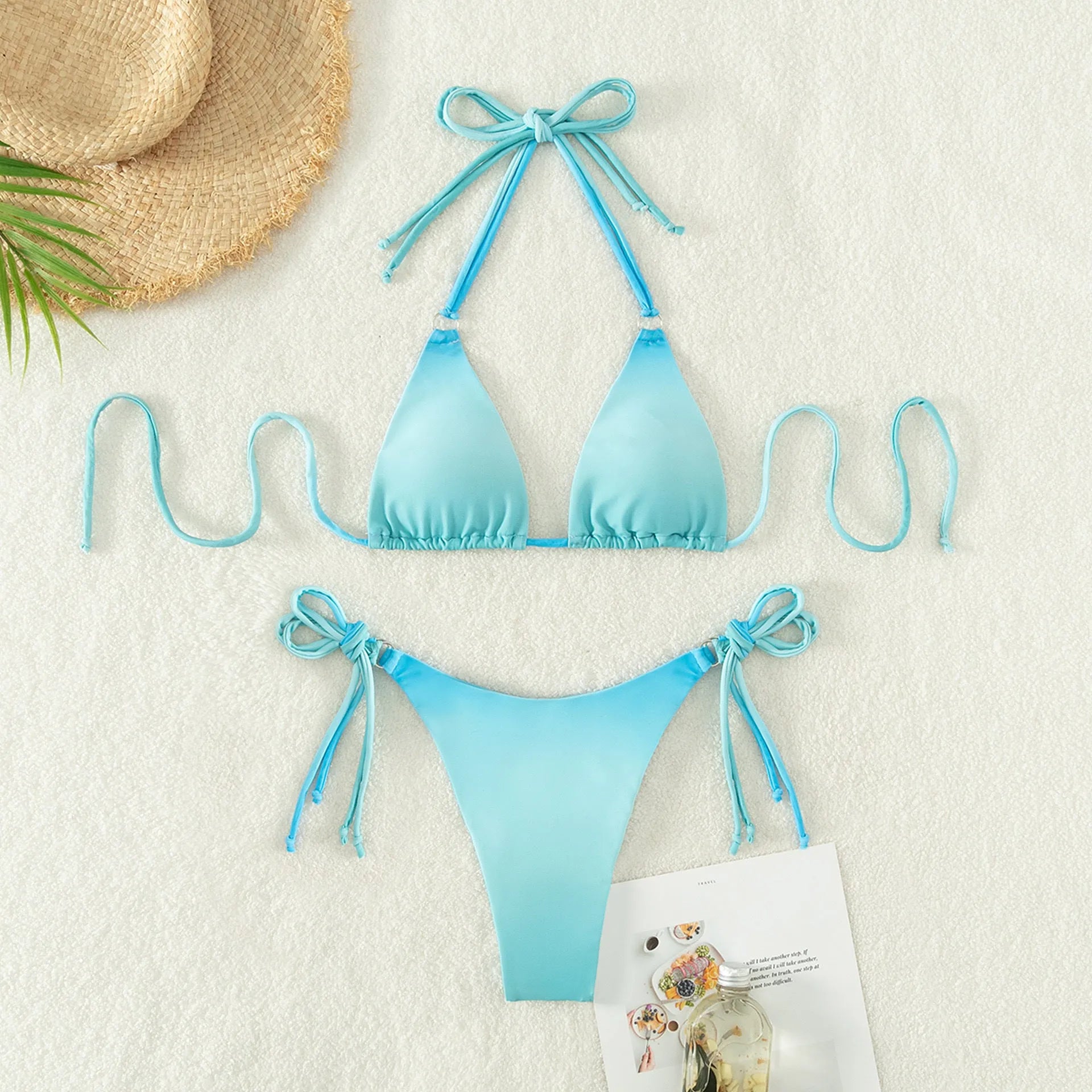 Women's two-piece gradient colour bikini swimwear set on a hanger.