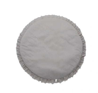 Circular baby play mat with lace border showing 2cm thickness measurement