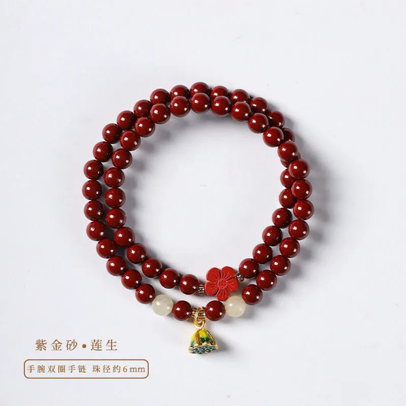 Close-up of a hand-woven purple gold cinnabar bead bracelet with a lotus seedpod charm.