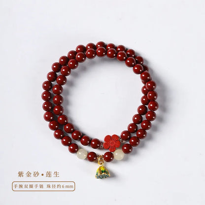 Close-up of a hand-woven purple gold cinnabar bead bracelet with a lotus seedpod charm.