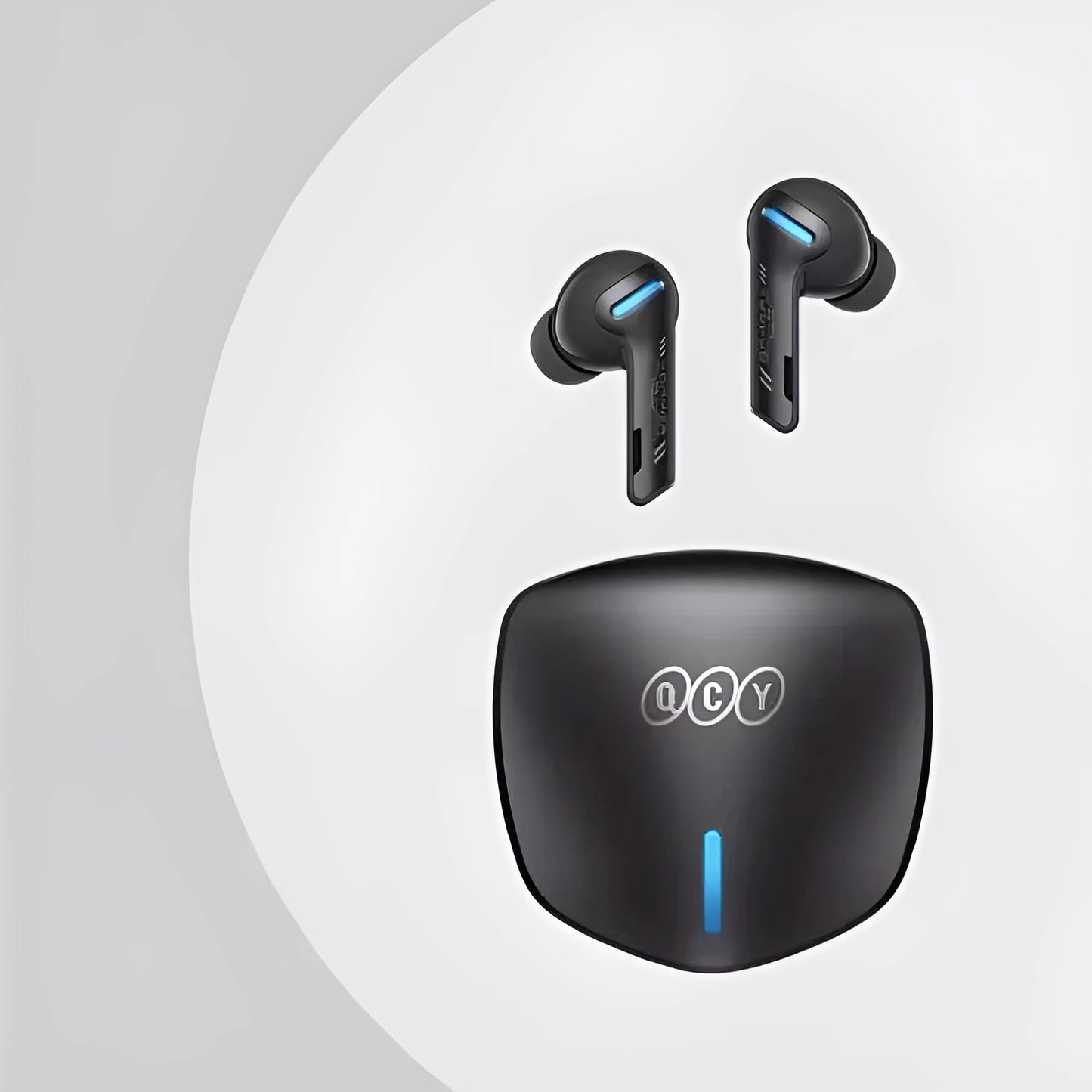 Grey QCY G1 Bluetooth wireless gaming earbuds with charging case and spare ear tips.