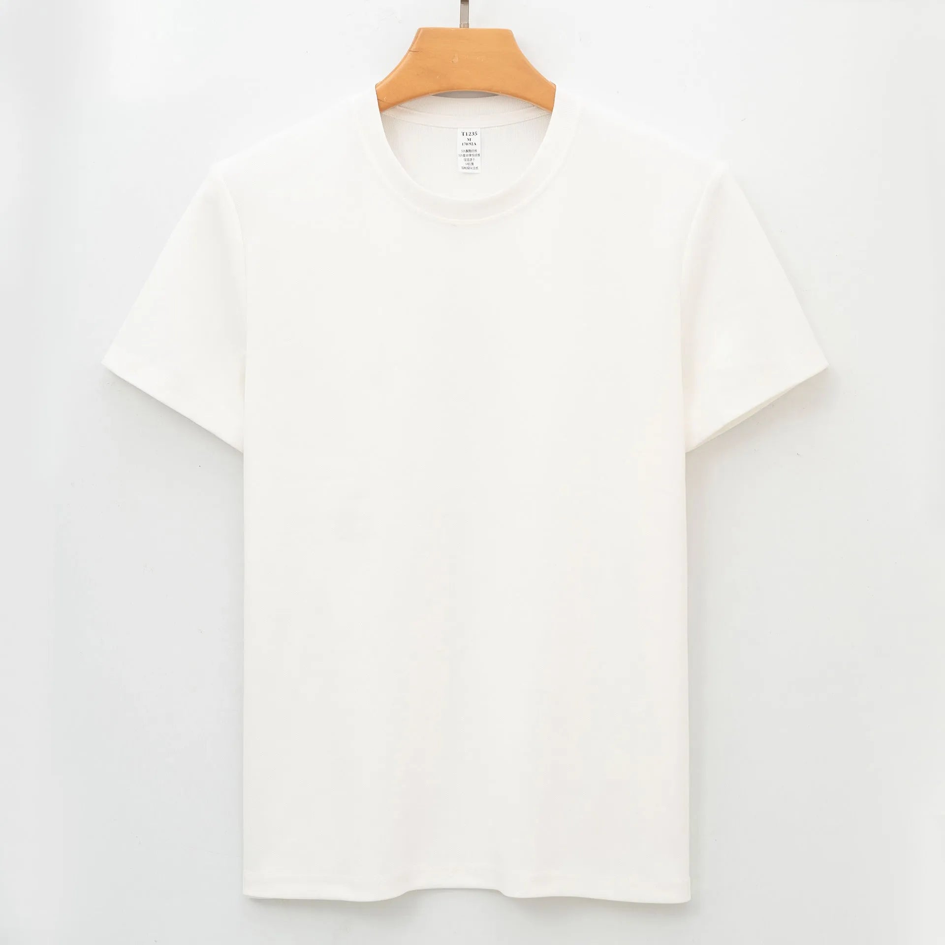 Men's solid colour antibacterial quick-dry short sleeve T-shirt on a hanger.