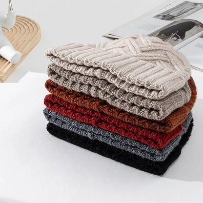 Wool knitted women's hat with dome crown in ankela red colour showing totem pattern details