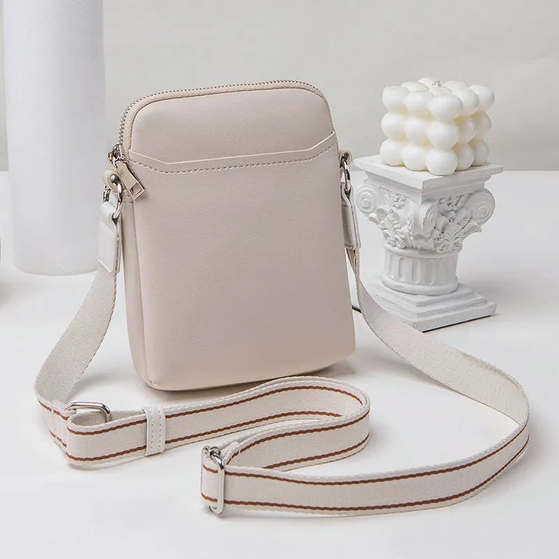 Solid colour mobile phone bag with adjustable strap showing 14.5x5.5x19cm dimensions and PU material construction