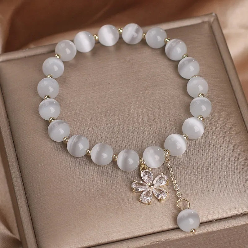 White cat's eye crystal women's bracelet with floral tassels and adjustable safety buckle clasp