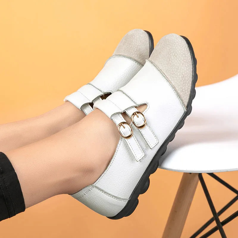 Women's low-top casual shoes in black with Velcro strap and rounded toe, showcasing cow split leather upper and beef tendon sole.
