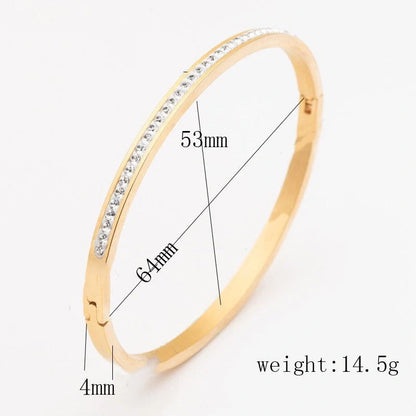 Elegant stainless steel bracelet with diamond accent, available in gold, rose gold, and steel finishes.