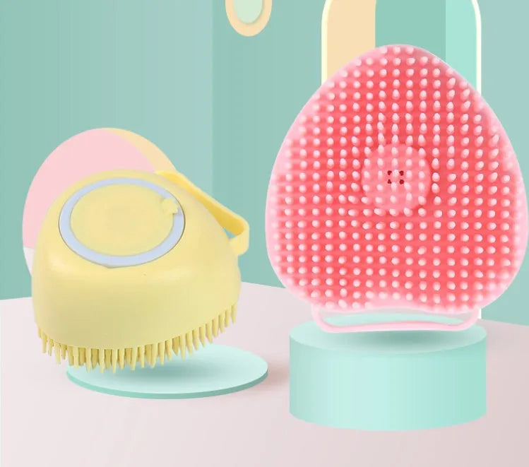 Silicone dog bath brush for pet grooming and massage with soft silicone bristles in blue, pink, or yellow, measuring 9x6x8.5 cm for handheld use during washing