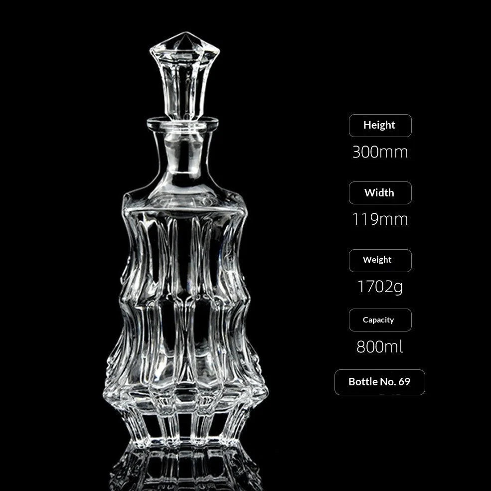 Hand-cut Bohemian crystal whiskey decanter with retro design and tapered pouring neck on wooden bar