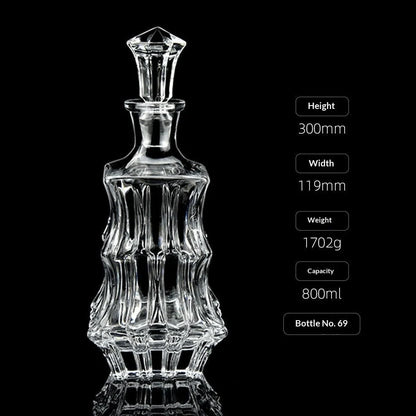 Hand-cut Bohemian crystal whiskey decanter with retro design and tapered pouring neck on wooden bar