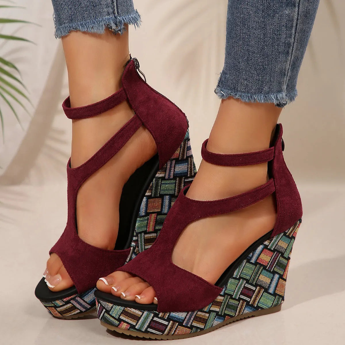 Women's thick-soled ankle-strap buckle sandals in cream white, showing cloth upper and rubber sole.