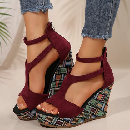 Women's thick-soled ankle-strap buckle sandals in cream white, showing cloth upper and rubber sole.