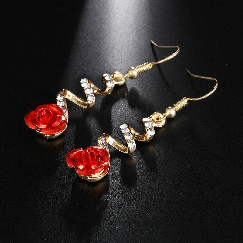 Ethnic red rose drop earrings with big rhinestones in rose gold spiral design