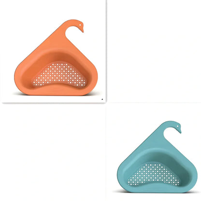 Yellow swan-shaped plastic kitchen drainer basket with drainage holes on kitchen counter