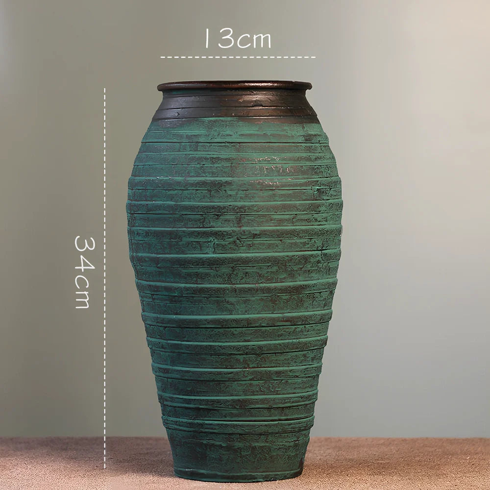 Ceramic mosaic vase with dried flowers, showing mosaic pattern and 25cm height