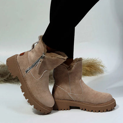 Women's black high top snow boots with a faux suede upper and side zipper on a white background.