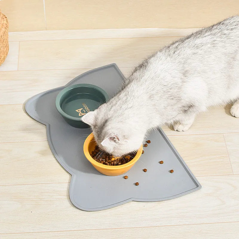 Blue silicone pet feeding mat in cat head shape for dog and cat food bowls
