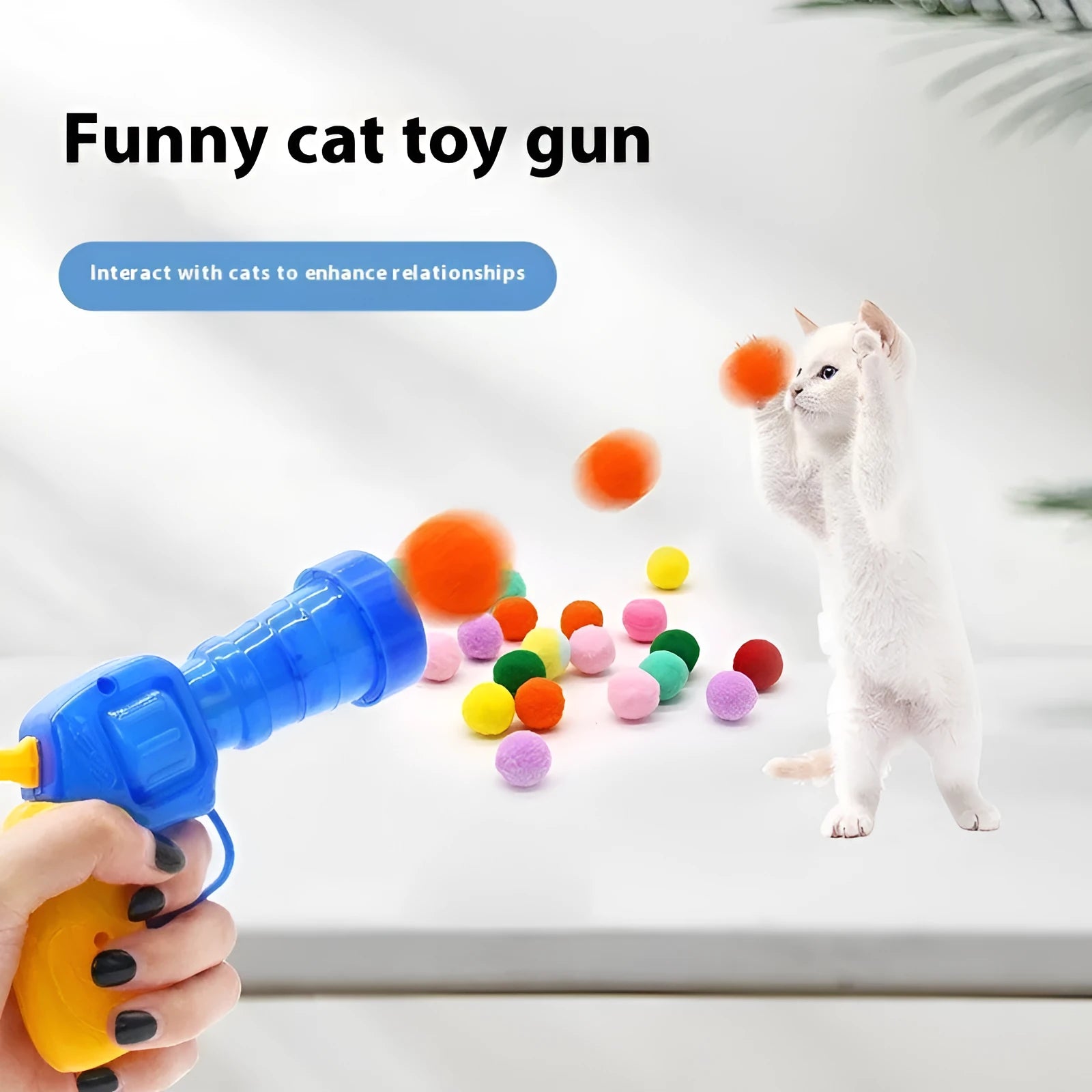 Interactive plastic pet toy gun and soft plush yarn balls on a carpet for fetch games.