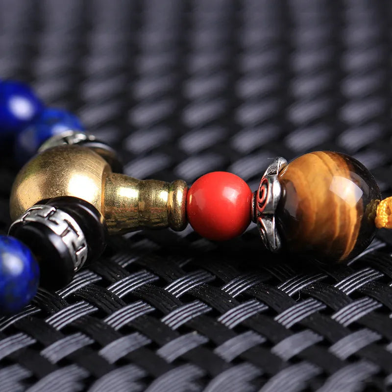 Natural lapis lazuli 108 bead bracelet with zodiac animal modelling in blue stone with gold flecks